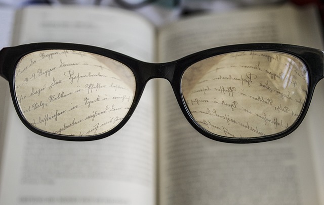 Looking through glasses to clarify unfocused text.
